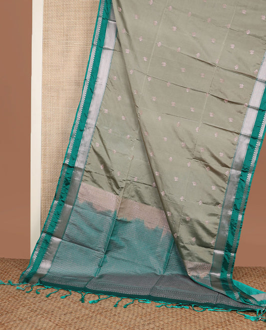 Grey zari buttas soft silk saree, contrast traditional zari border, and pallu of chevron design