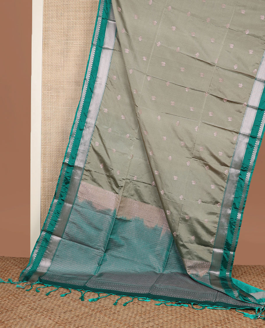 Grey zari buttas soft silk saree, contrast traditional zari border, and pallu of chevron design