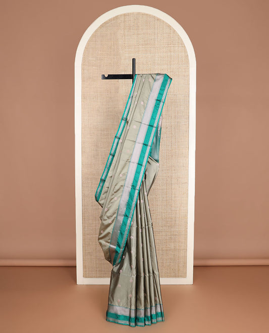 Grey zari buttas soft silk saree, contrast traditional zari border, and pallu of chevron design