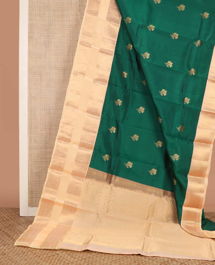 Green zari buttas Vasundhara silk mix saree, contrast rettai pettu border of rekku, muthu, neli, and manga designs, and ogee patterned pallu