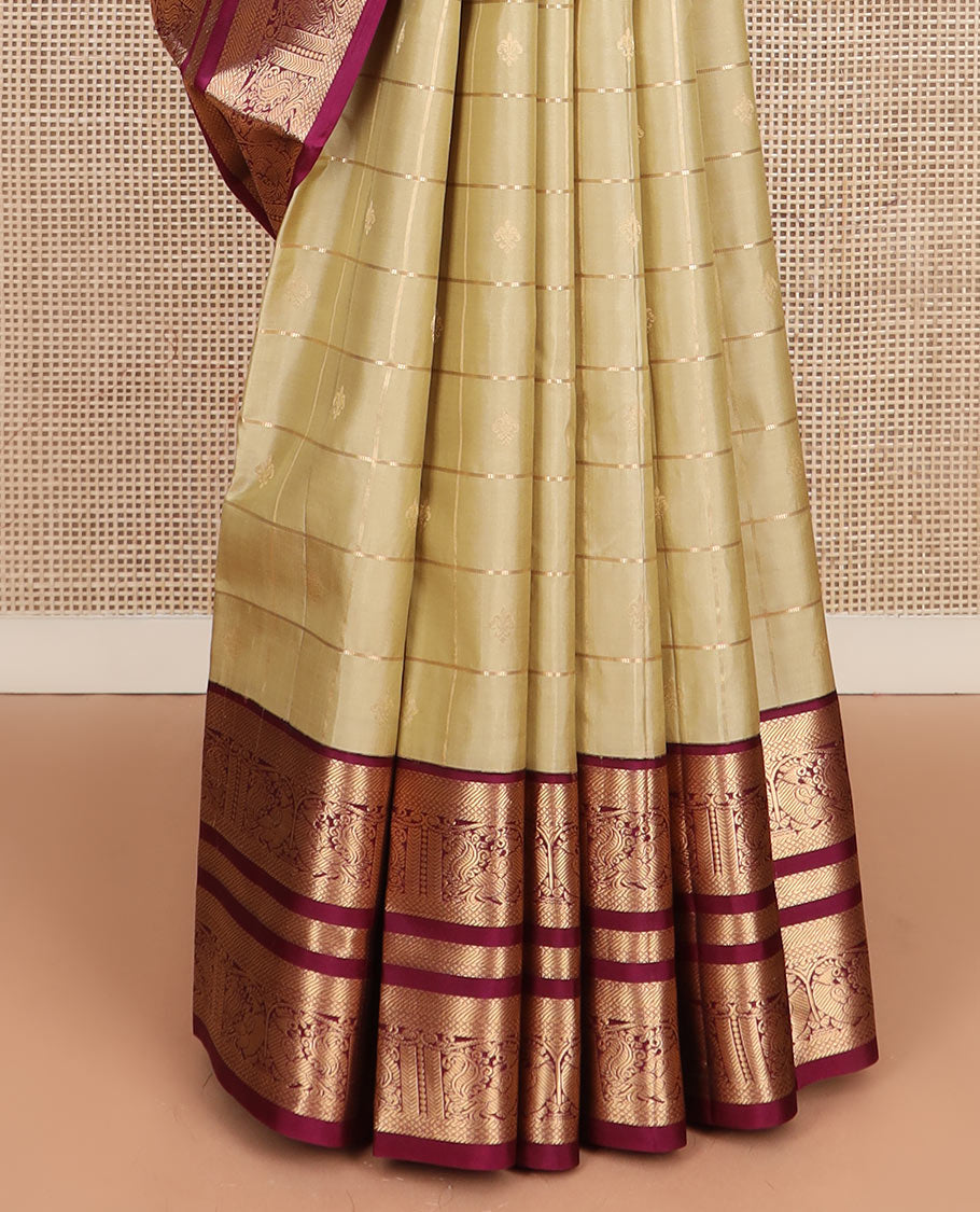 Light gold zari buttas and checked silk saree, contrast border of banaras, mayil kann, and mayil designs, and zari-rich jaal pallu
