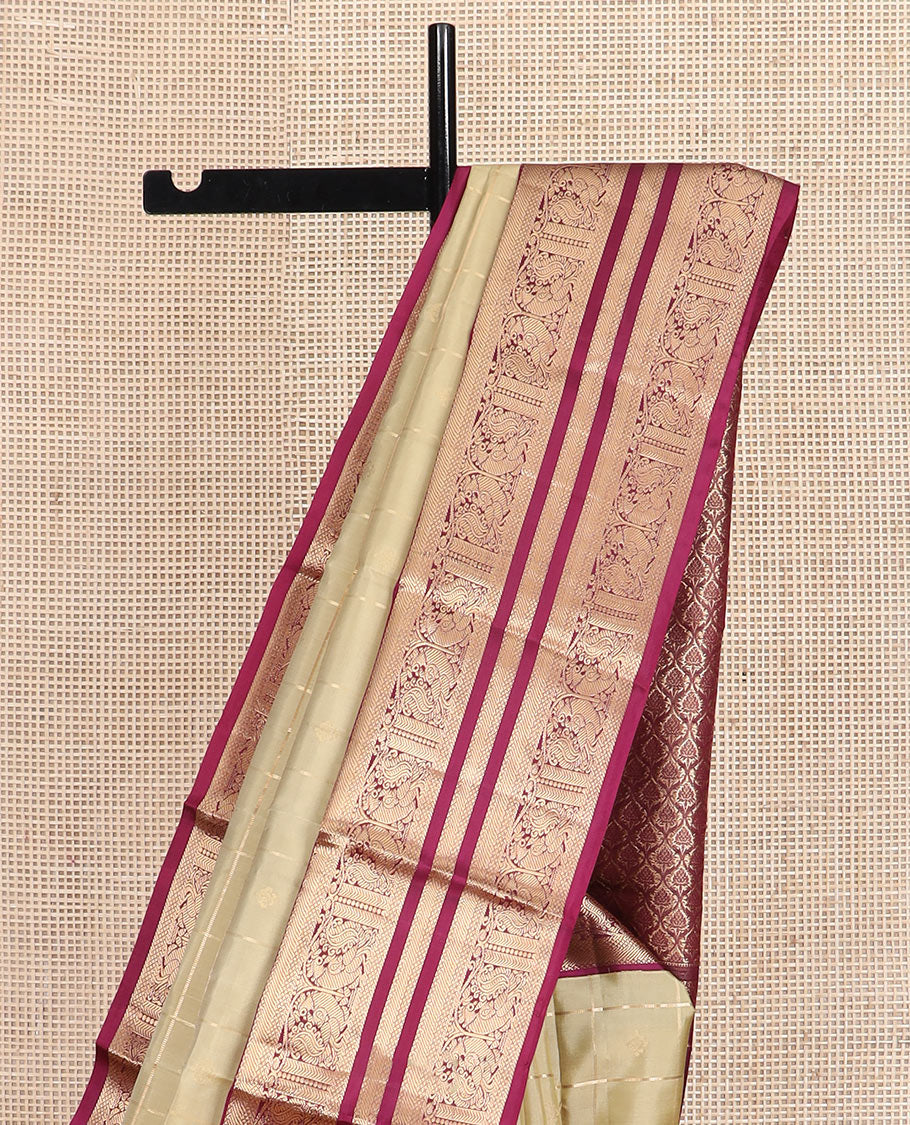 Light gold zari buttas and checked silk saree, contrast border of banaras, mayil kann, and mayil designs, and zari-rich jaal pallu