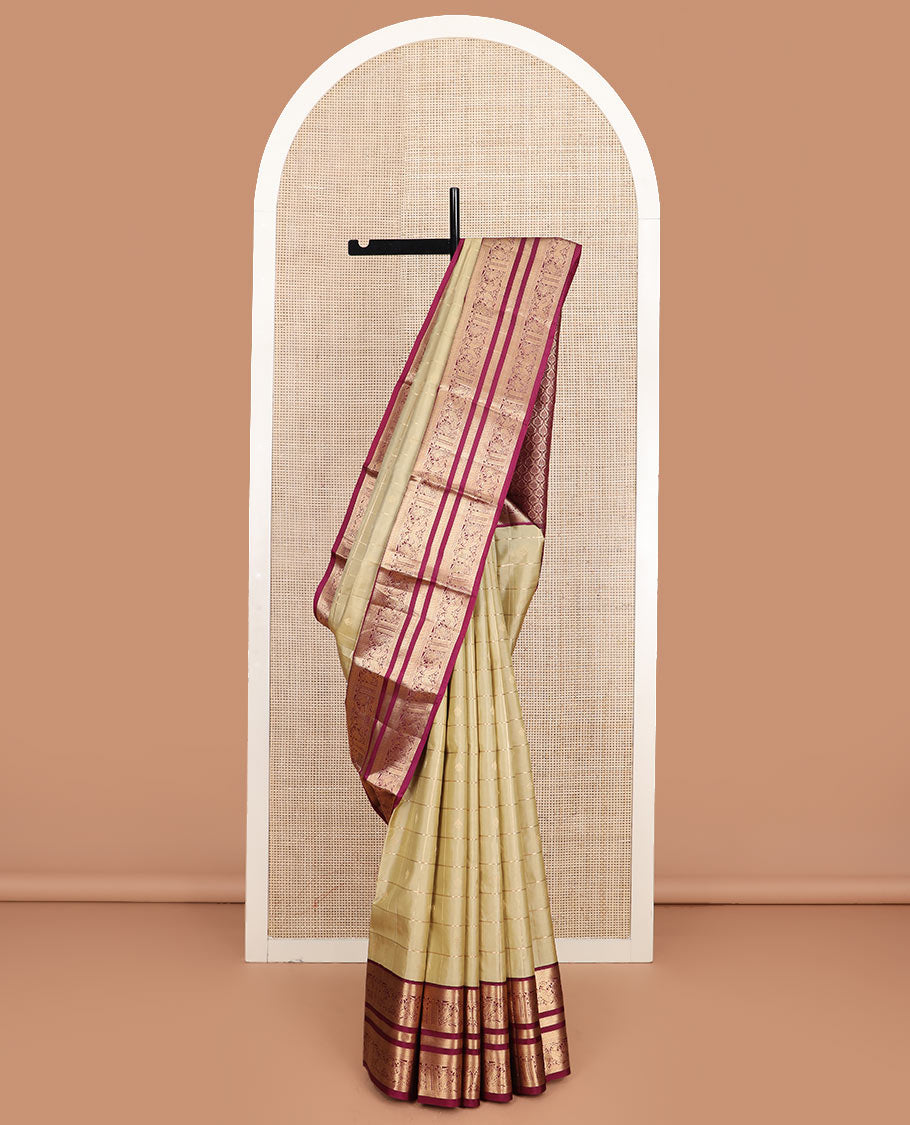 Light gold zari buttas and checked silk saree, contrast border of banaras, mayil kann, and mayil designs, and zari-rich jaal pallu