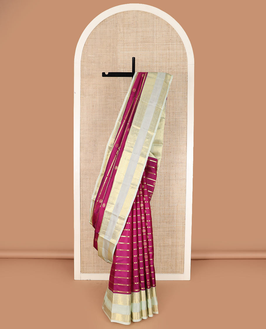 Pink zari design silk saree with contrast rettai pettu border of round mayil, muthu, neli, and diamond designs, and intricate pallu