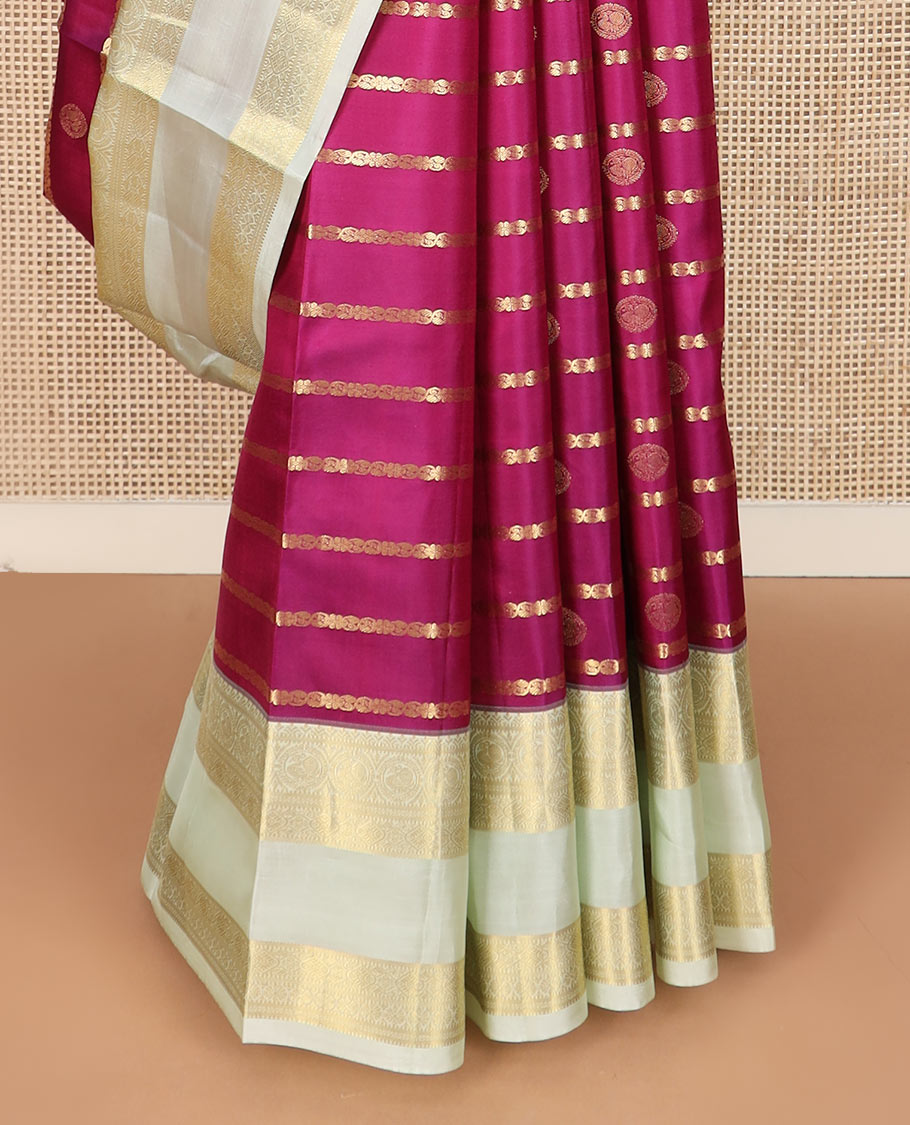 Pink zari design silk saree with contrast rettai pettu border of round mayil, muthu, neli, and diamond designs, and intricate pallu