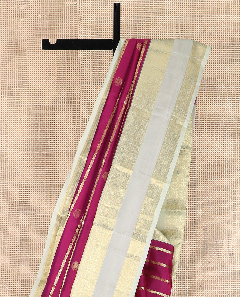 Pink zari design silk saree with contrast rettai pettu border of round mayil, muthu, neli, and diamond designs, and intricate pallu