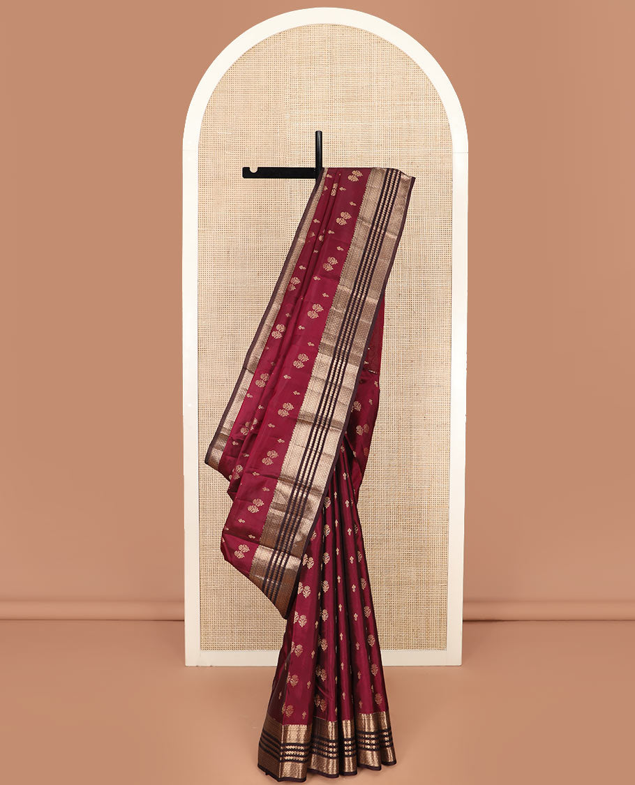 Light Maroon Vasundhara Silk Saree Gracefully Embellished with Zari Buttas, Complemented by a Contrast Border of Geometric Designs, Majestically Detailed Pallu of Floral Jaal Designs, and a Contrast Blouse