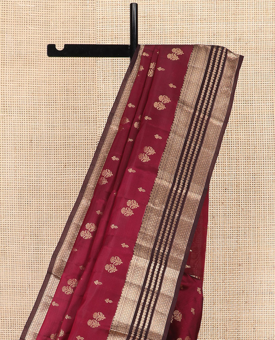 Light Maroon Vasundhara Silk Saree Gracefully Embellished with Zari Buttas, Complemented by a Contrast Border of Geometric Designs, Majestically Detailed Pallu of Floral Jaal Designs, and a Contrast Blouse
