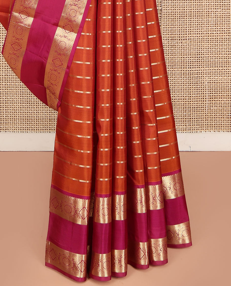 Orange Vasundhara Silk Saree, Richly Detailed with Zari Stripes All Over Its Body, Complemented by Contrast Rettai Pettu Border of Manga, Muthu, Diamond and Chakram Designs, Intricately Zari Detailed Pallu, and Paired with a Contrast Blouse