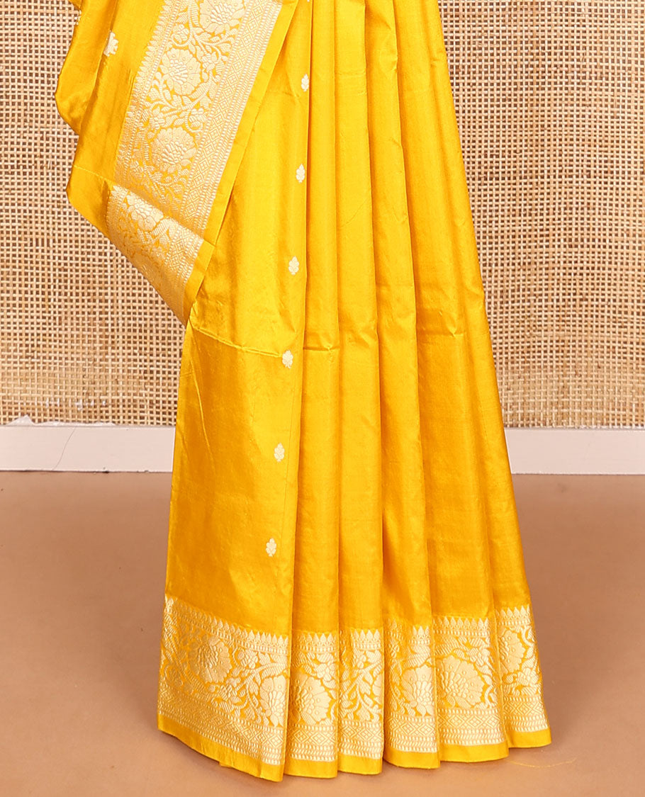 Yellow buttas banarasi kathan silk saree, floral creeper border, and pallu of paisley jaal design