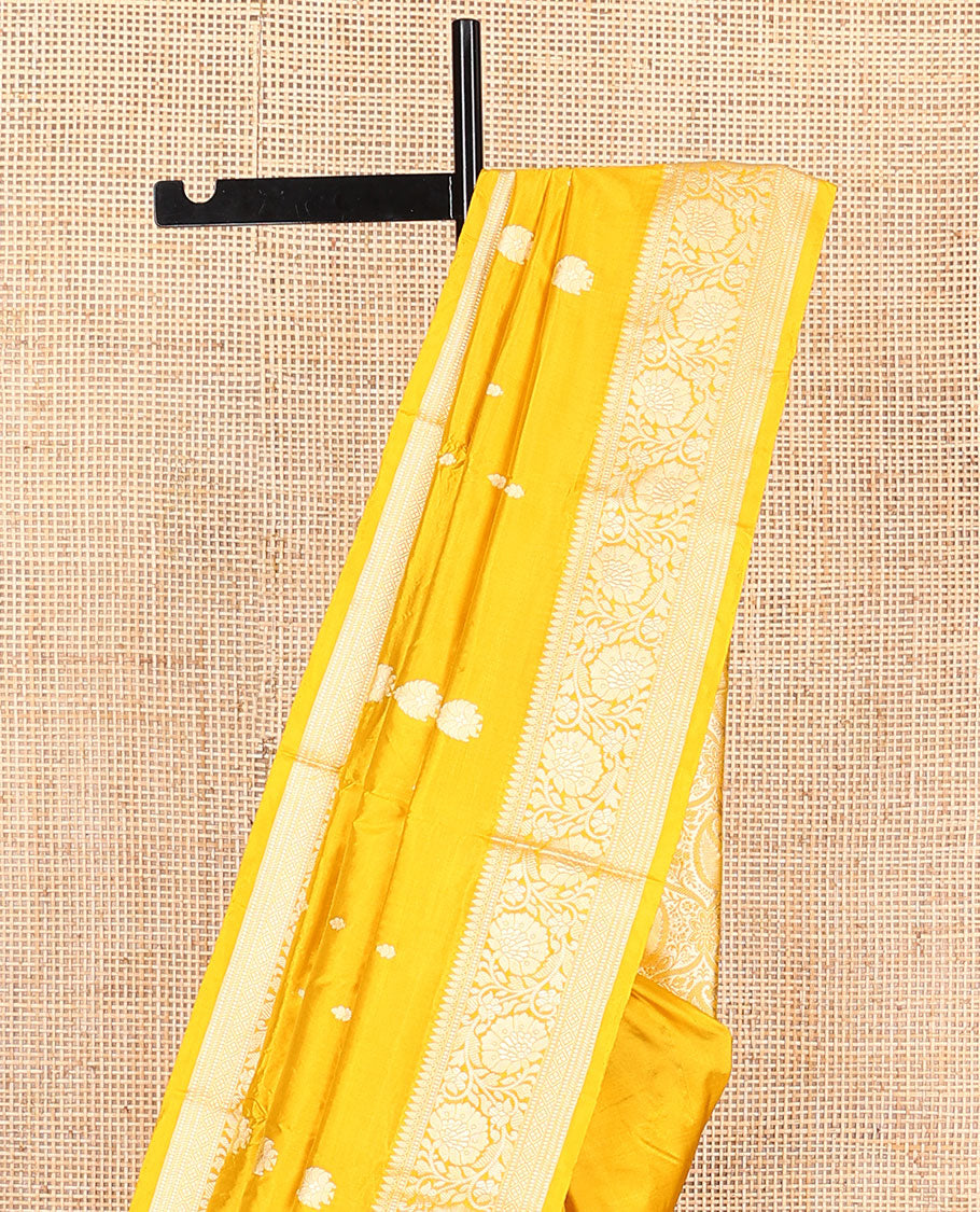 Yellow buttas banarasi kathan silk saree, floral creeper border, and pallu of paisley jaal design