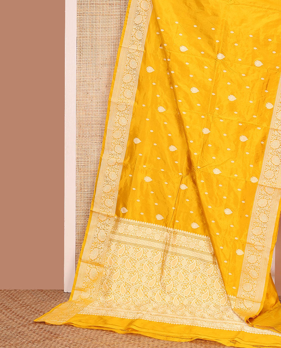 Yellow buttas banarasi kathan silk saree, floral creeper border, and pallu of paisley jaal design