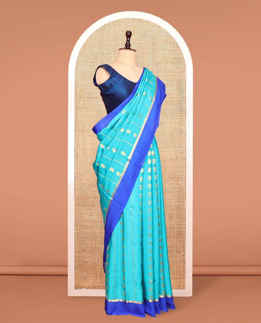 Blue Mysore Silk Saree, Adorned With Zari Stripes and Peacock Buttas Across Its Body, Complemented by Captivating Contrast Border of Traditional Zari Designs, Pallu Steeped with Traditional Zari Designs, and Paired with a Contrast Blouse