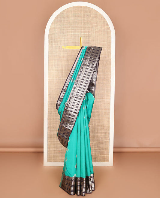 Light blue zari buttas Vasundhara silk mix saree, contrast temple border of kodi visiry, kathir & Annam chakram & intricate pallu