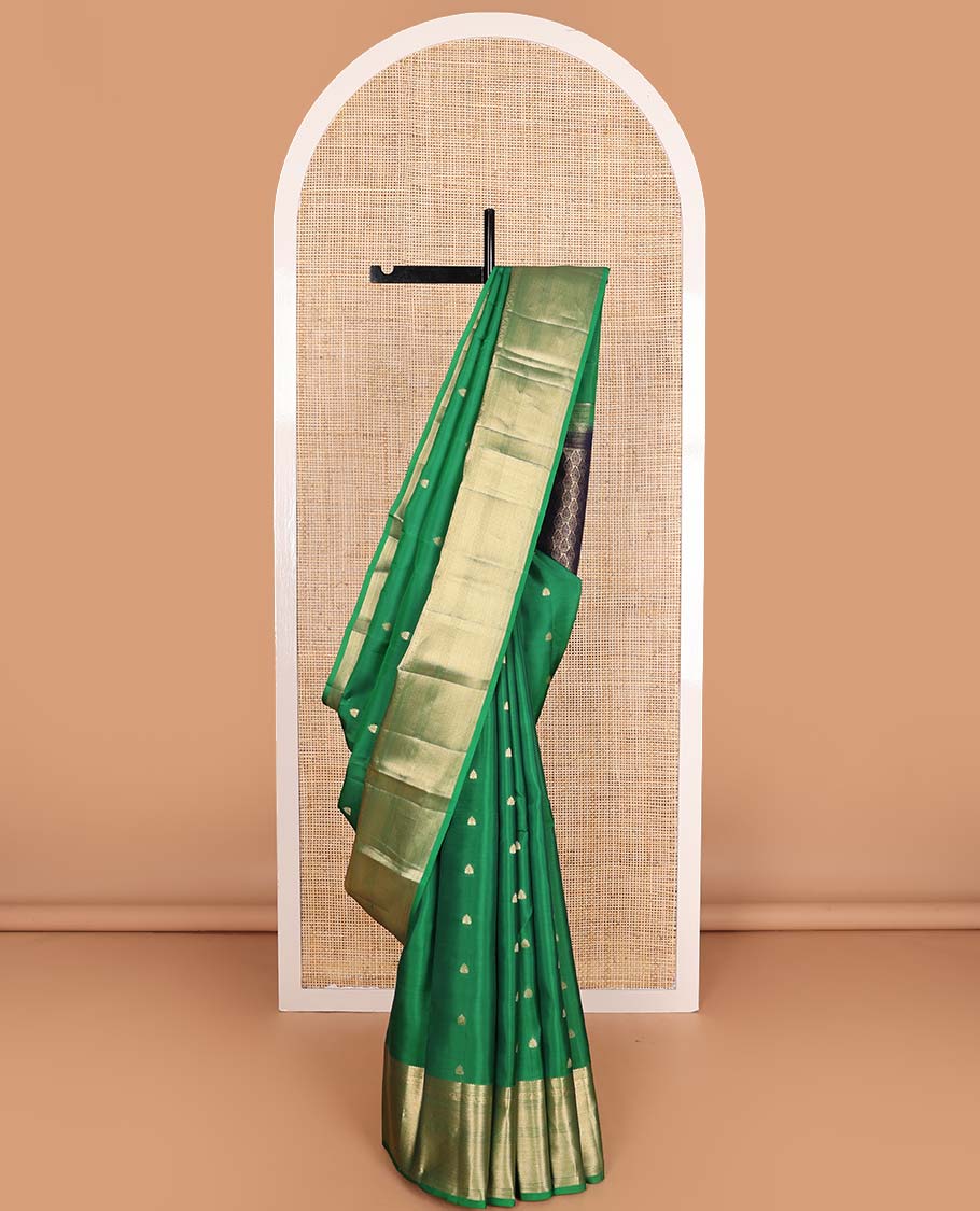 Green rettai manga buttas Vasundhara silk mix saree, traditional design zari border, and contrast intricate pallu