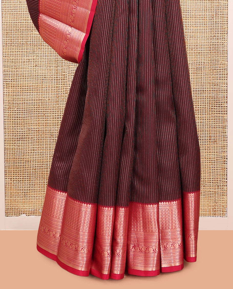 Maroon Vasundhara Silk Saree, Gleamed Up with Vaira Oosi Stripes, a Contrast Border of Thilakam Mokku, Muthu, Rettai Neli, Kathir, and Kodi Visiry Designs, Grand Pallu, and a Contrast Blouse