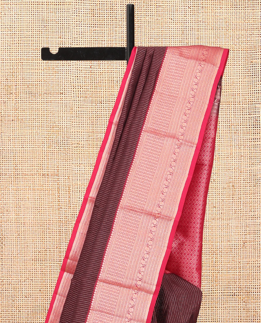 Maroon Vasundhara Silk Saree, Gleamed Up with Vaira Oosi Stripes, a Contrast Border of Thilakam Mokku, Muthu, Rettai Neli, Kathir, and Kodi Visiry Designs, Grand Pallu, and a Contrast Blouse