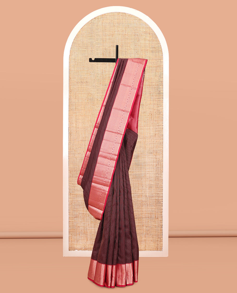 Maroon Vasundhara Silk Saree, Gleamed Up with Vaira Oosi Stripes, a Contrast Border of Thilakam Mokku, Muthu, Rettai Neli, Kathir, and Kodi Visiry Designs, Grand Pallu, and a Contrast Blouse