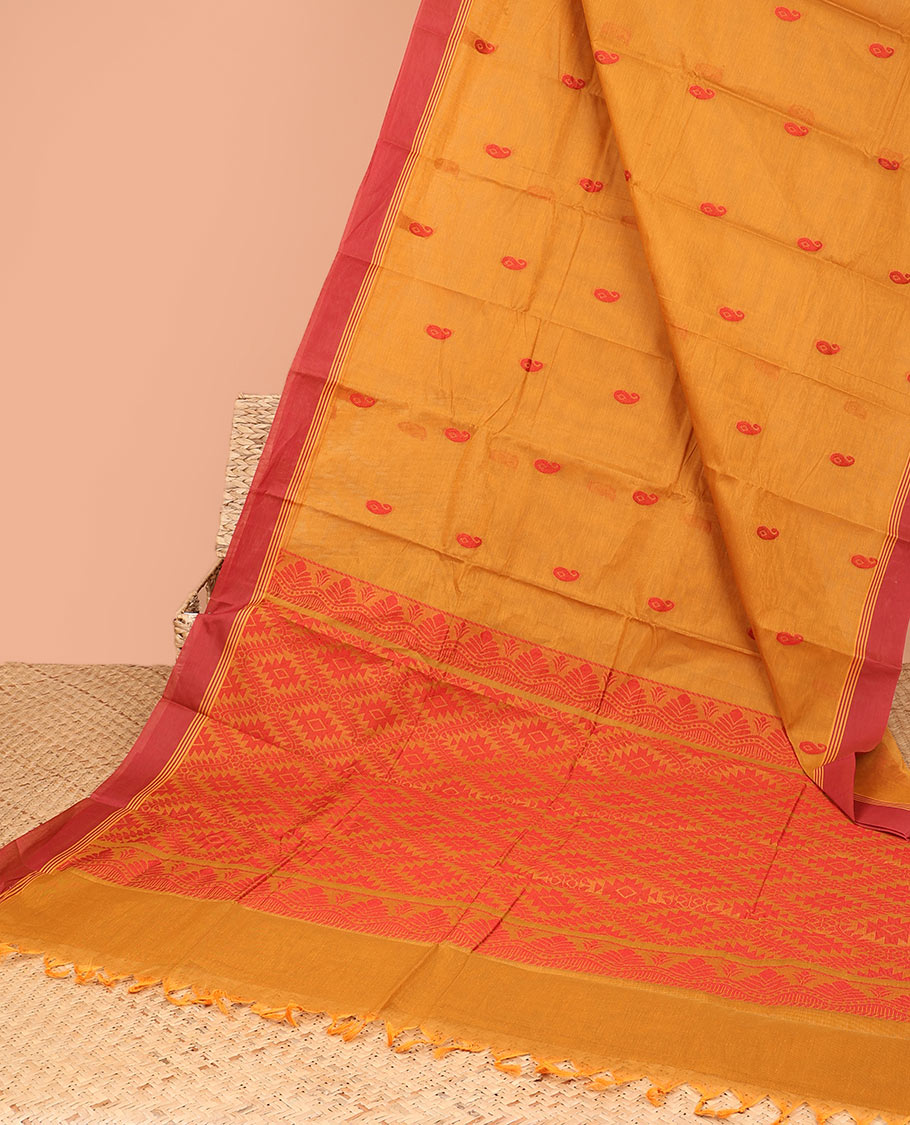 Orange kanchi cotton saree with paisley buttas, contrast border & pallu of argyle designs