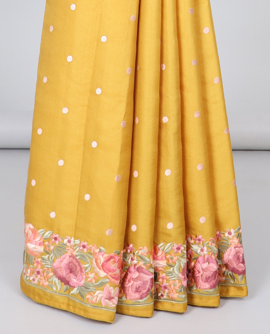 Yellow semi-banaras tussar saree with polka dots, colorful floral motifs thread embroidered border