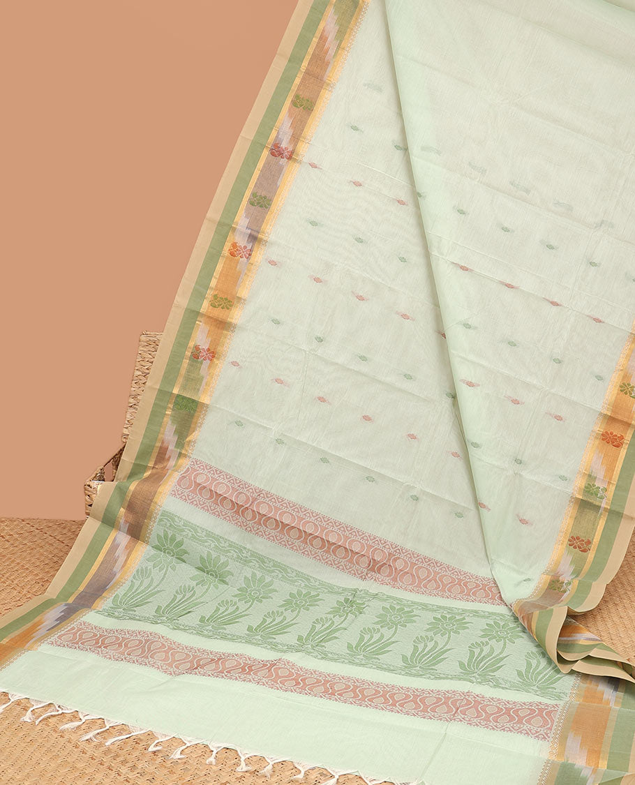 Pale green kanchi cotton saree with buttas, contrast ikkat border & floral design pallu