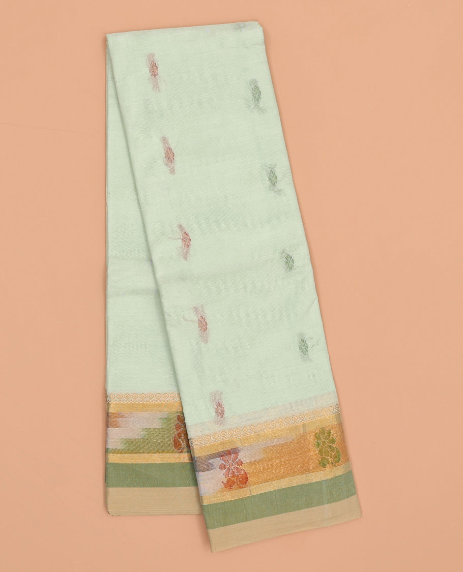 Pale green kanchi cotton saree with buttas, contrast ikkat border & floral design pallu