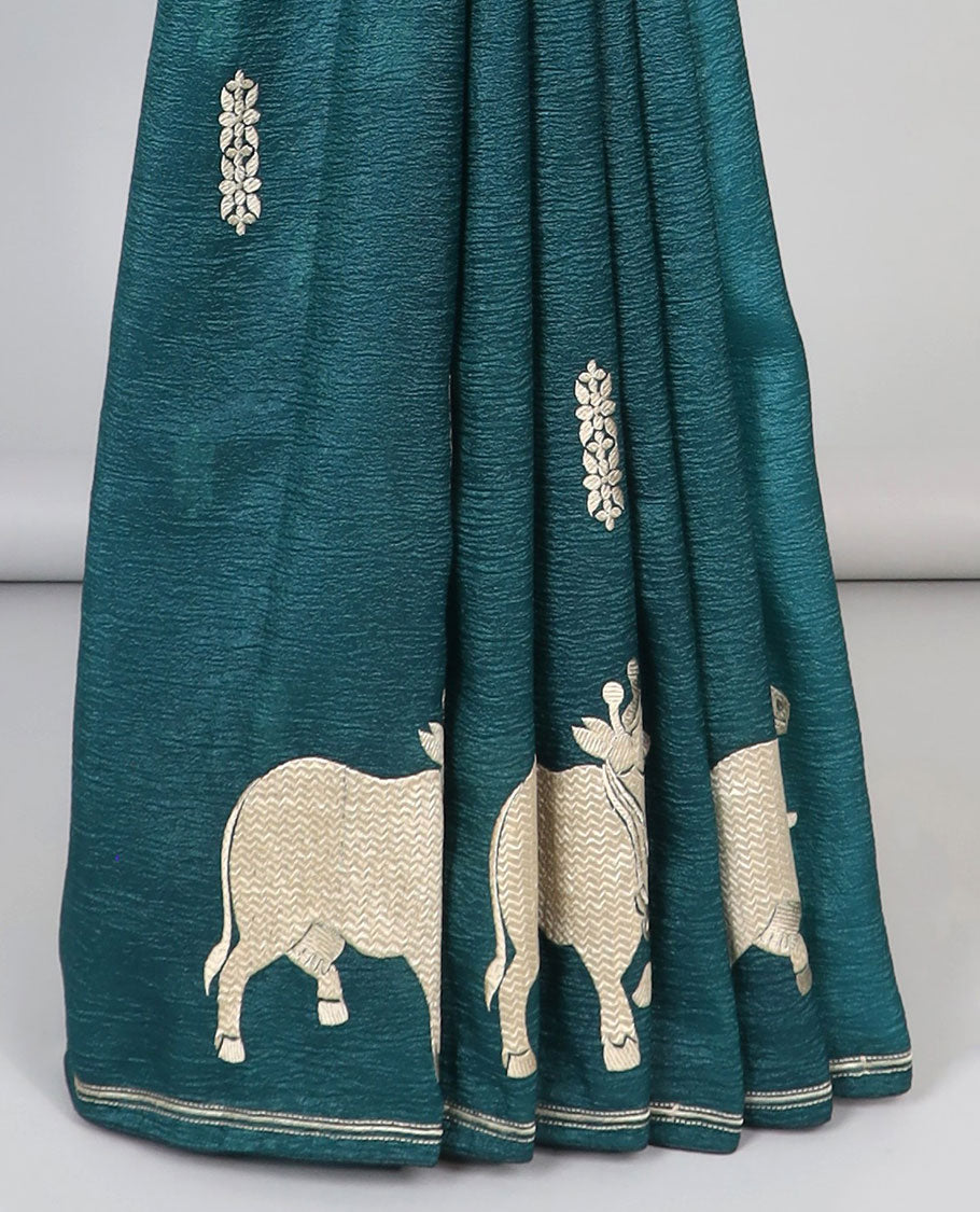 Borderless blue crushed tissue saree with buttas & pichwai cow buttas, intricate pallu