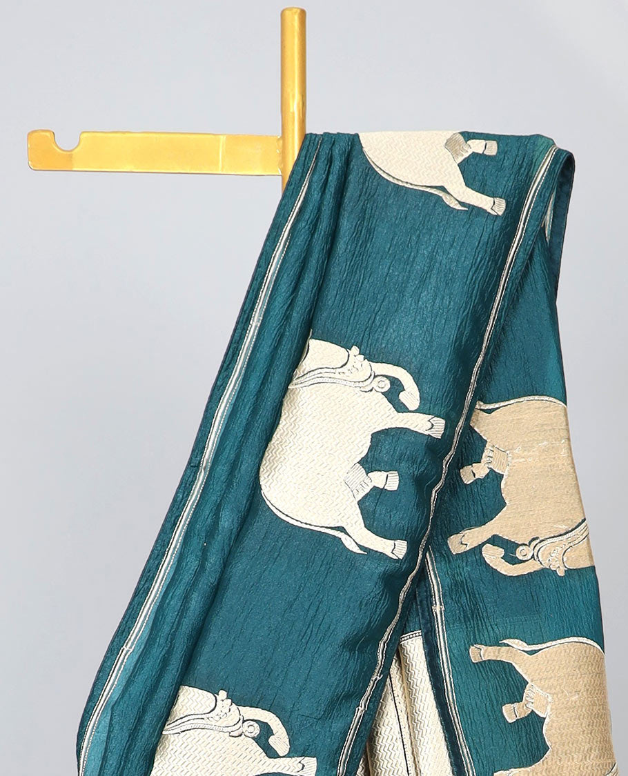 Borderless blue crushed tissue saree with buttas & pichwai cow buttas, intricate pallu
