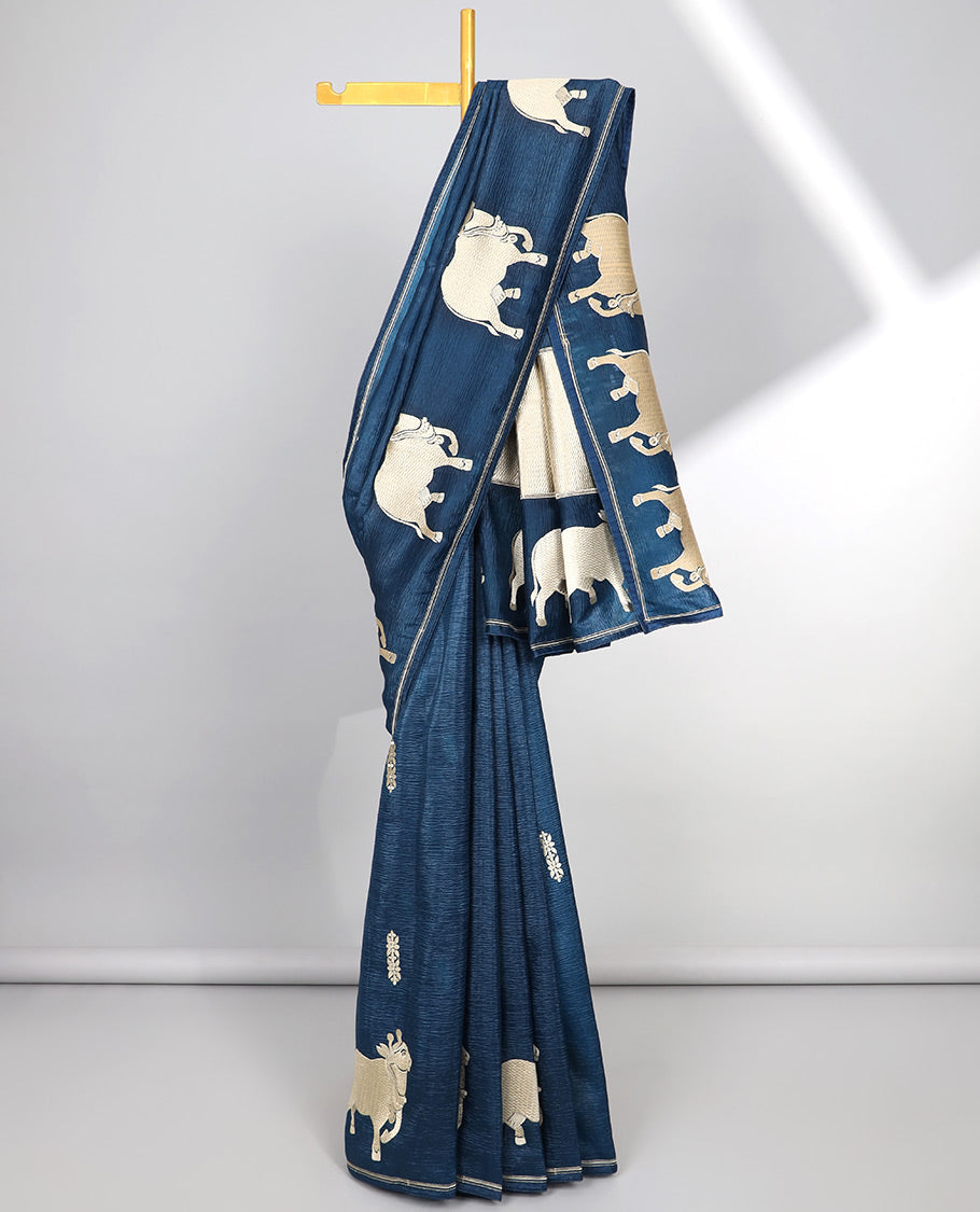 Borderless green crushed tissue saree with buttas & pichwai cow buttas, intricate pallu