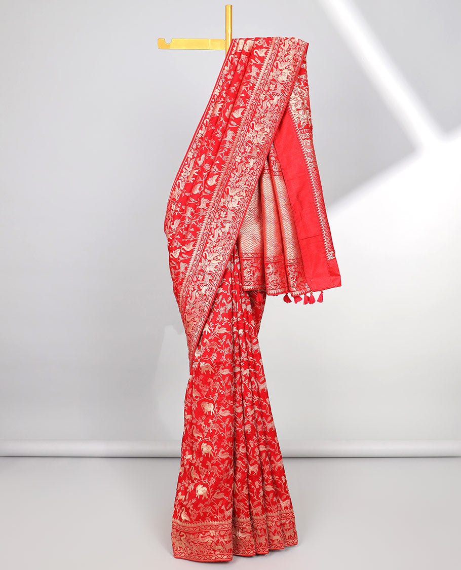 Blue floral & animal jacquard semi-banaras dola silk saree, floral & animal designs & chevron design pallu