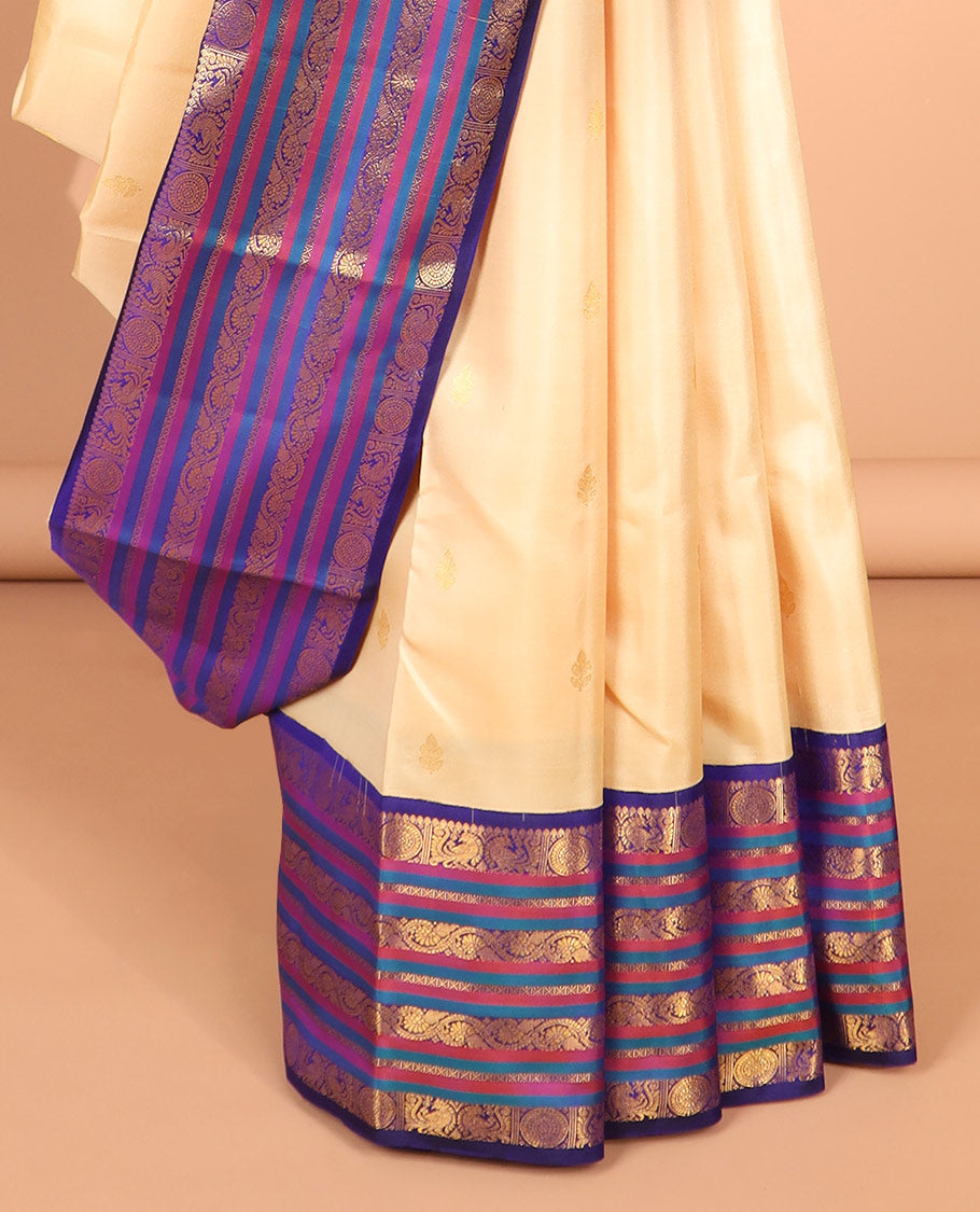 Cream zari buttas silk saree, contrast korvai border of mayil,chakram & neli kodi & intricate pallu