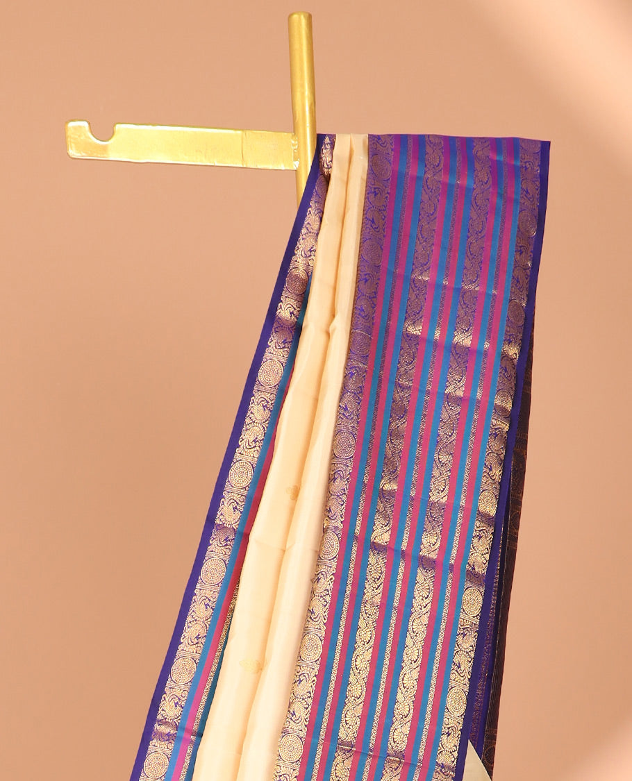 Cream zari buttas silk saree, contrast korvai border of mayil,chakram & neli kodi & intricate pallu
