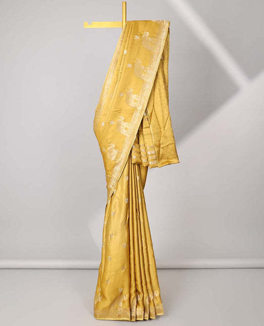Mustard mushru silk saree with buttas, peacock & chakram border & floral creeper pallu