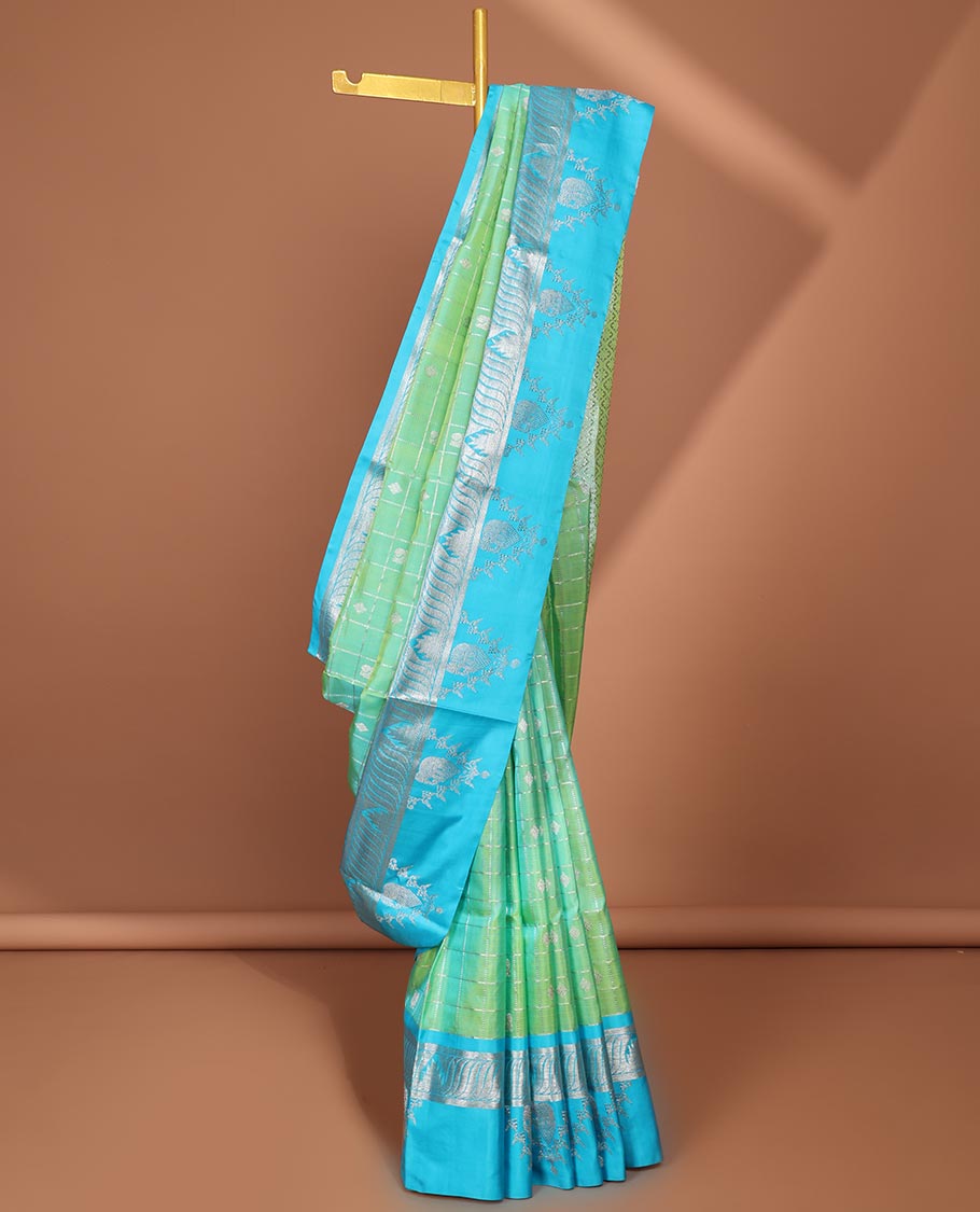 Green buttas enclosed checked Vengatagiri silk saree, contrast zari design border & pallu of jaal designs