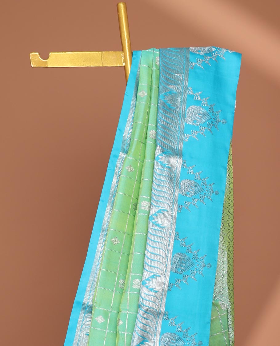 Green buttas enclosed checked Vengatagiri silk saree, contrast zari design border & pallu of jaal designs