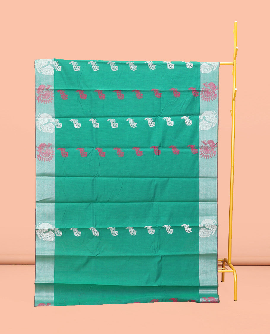 Green Semi-Silk Cotton Saree, Styled with Peacock Buttas All Over Its Body, Highlighted by a Self-Border of Peacock Designs, Pallu Steeped with Peacock Zari Design, and Paired with a Matching Blouse