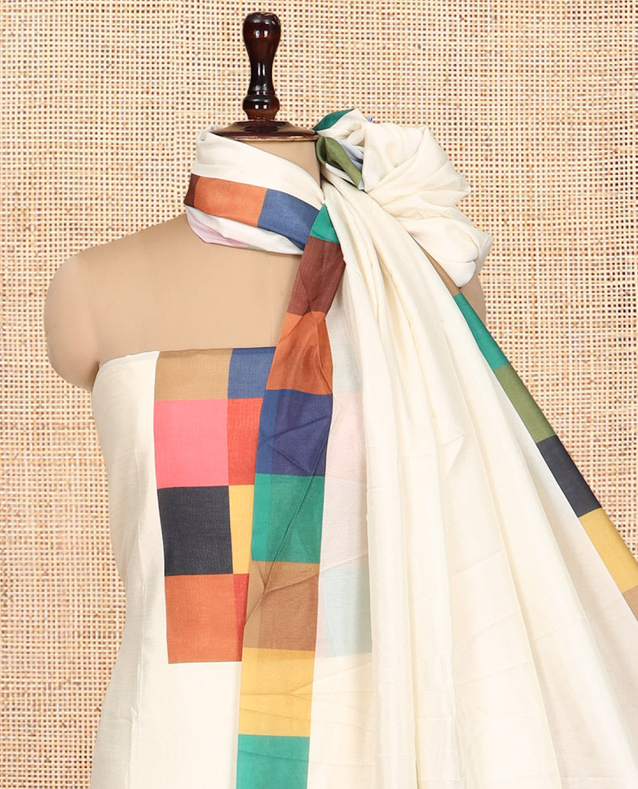 Cream Semi-Silk Material Churidar, Ornamented with Multi-Color Checked Top, a Plain Bottom, a Checked Bordered Plain Dupatta