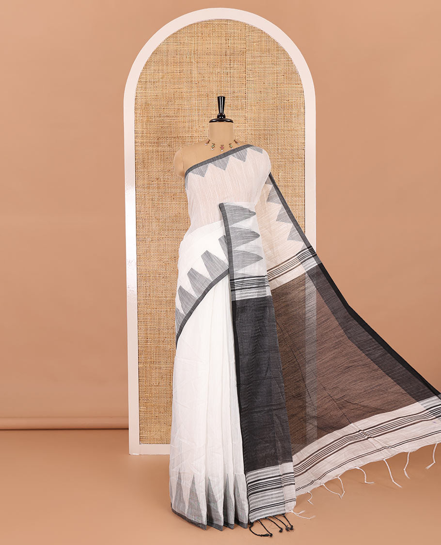 Half-white and grey plain khadi mul cotton saree, contrast thread temple border, plain pallu, and a contrast plain blouse