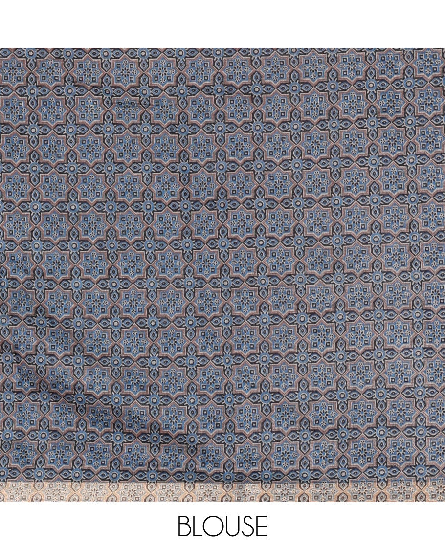 Purple bandhani-style floral and chakra printed saree, zari piping border, contrast ajrakh printed pallu, and contrast ajrakh printed blouse