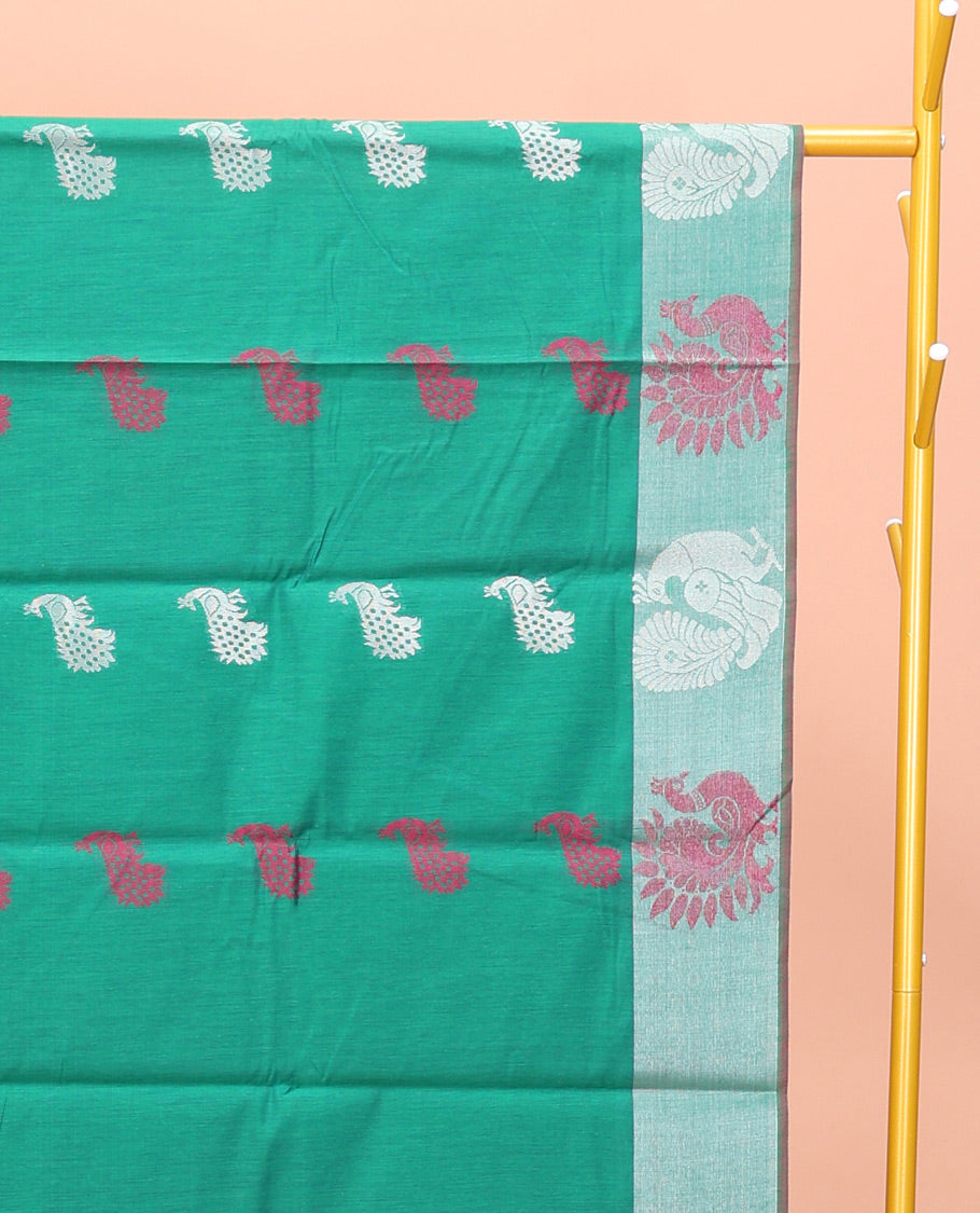 Green Semi-Silk Cotton Saree, Styled with Peacock Buttas All Over Its Body, Highlighted by a Self-Border of Peacock Designs, Pallu Steeped with Peacock Zari Design, and Paired with a Matching Blouse