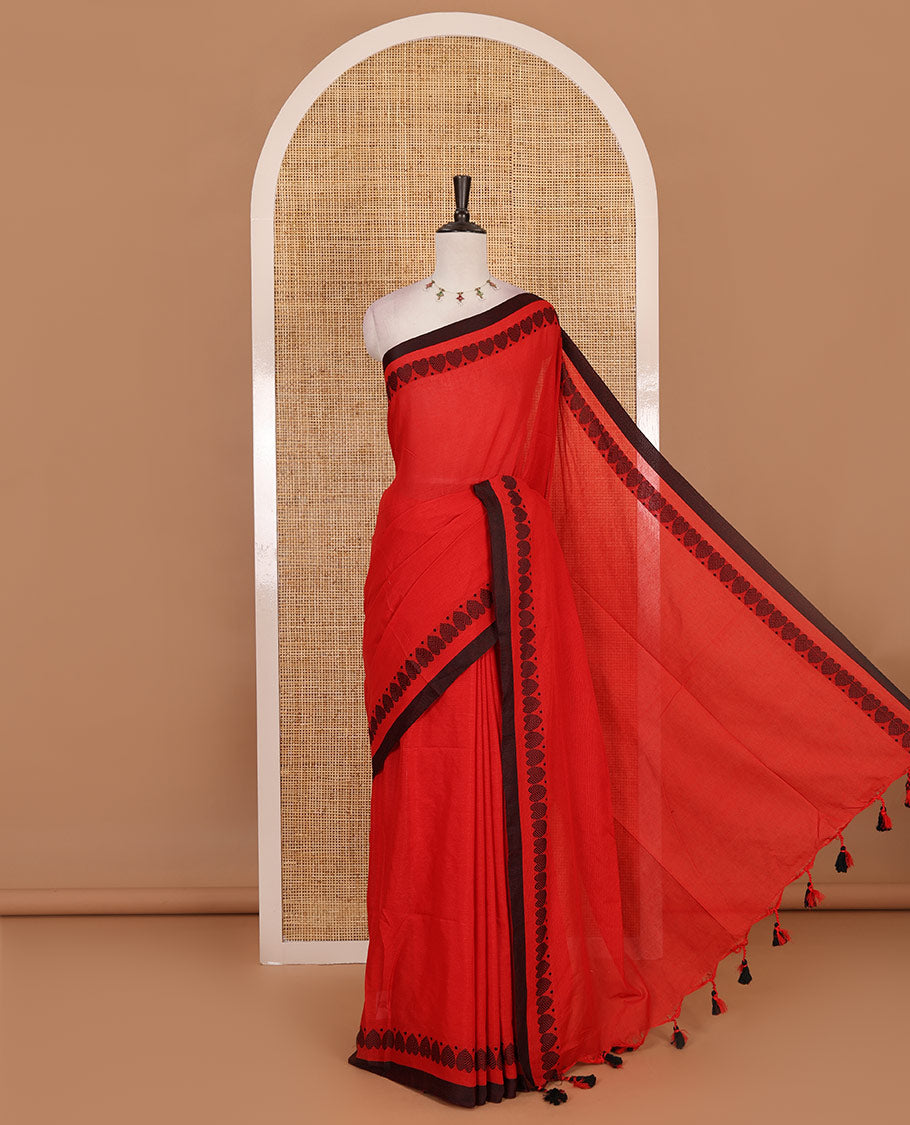 Red plain khadi cotton saree with contrast border and plain pallu with tussels