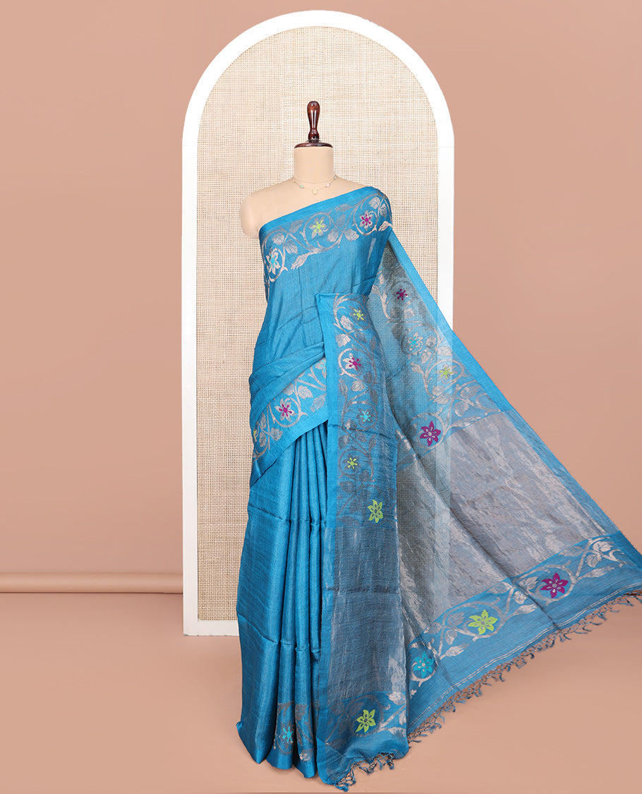 Blue Plain Tussar Silk Saree, Highlighted by Floral Creeper Design Border, Gleaming Zari Pallu, and Paired with a Contrast Blouse