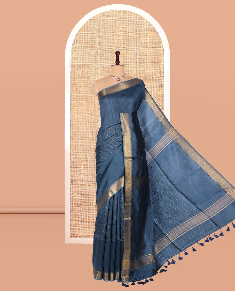 Blue Banana Pith Saree, Gleamed Up with Checks and Buttas, a Zari Temple Border, Striped Pallu, and Matching Blouse