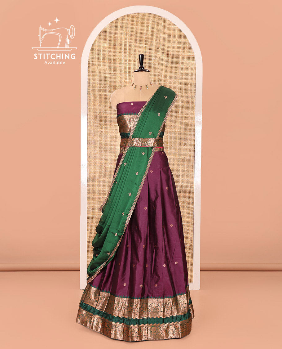 Purple-Green Semi-Banarasi Half-Saree Featuring Zari Buttas on Its Skirt, Complemented by a Contrast Traditional Zari Temple Rettai Pettu Border, Paired with a Matching Blouse, and a Satin Georgette Embroidered Scallop Dhavani