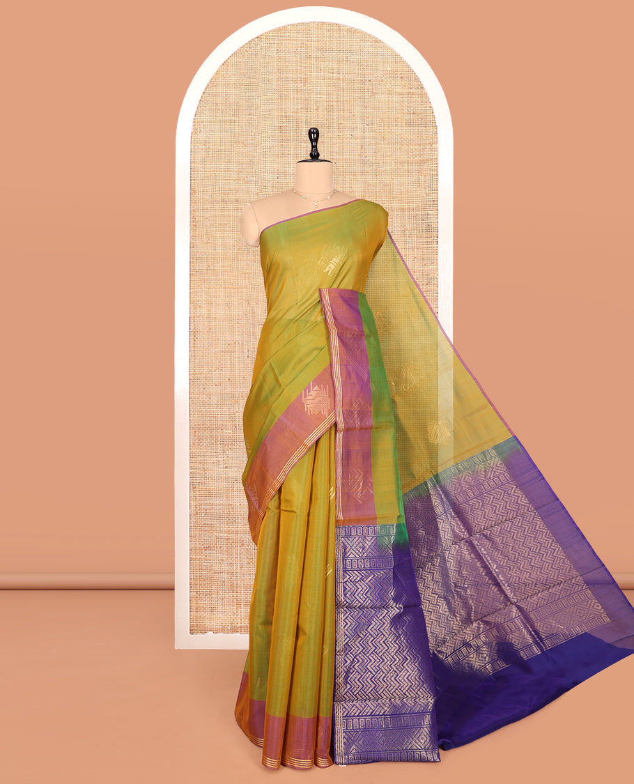 Green Silk Cotton Saree, Decked Up with Zari Buttas, Complemented by Contrast Zari Border, a Pallu of Geometric Designs, and Contrast Blouse