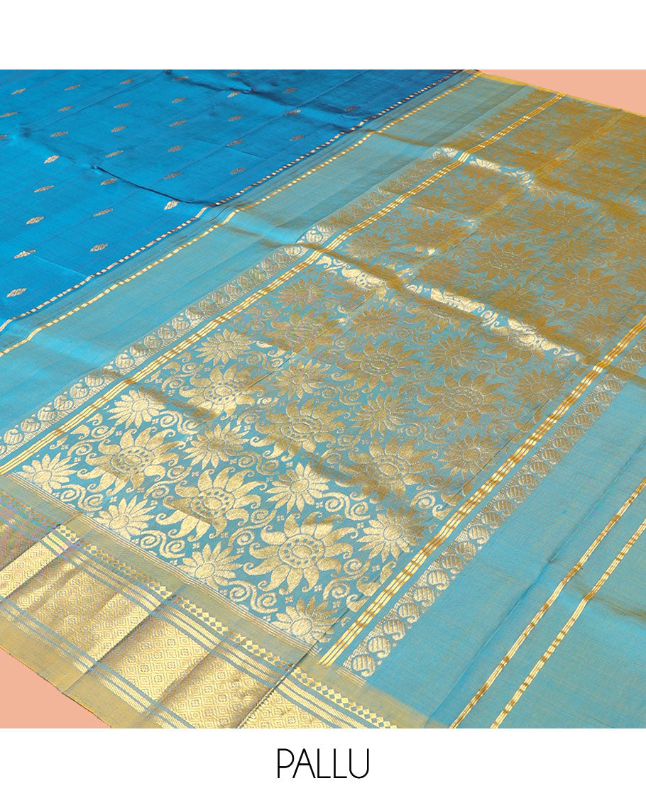 Blue Kanchipuram Silk Saree, Gleamed Up with Zari Buttas, a Contrast One-Sided Border of Panner Sombu, Banaras, and Jaal Designs, a Zari Design Pallu, and No Blouse