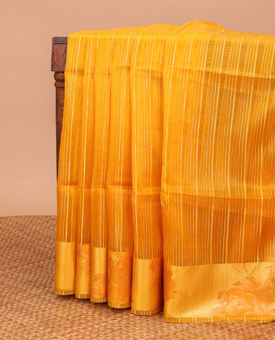 Orange striped organza saree with contrast floral design border