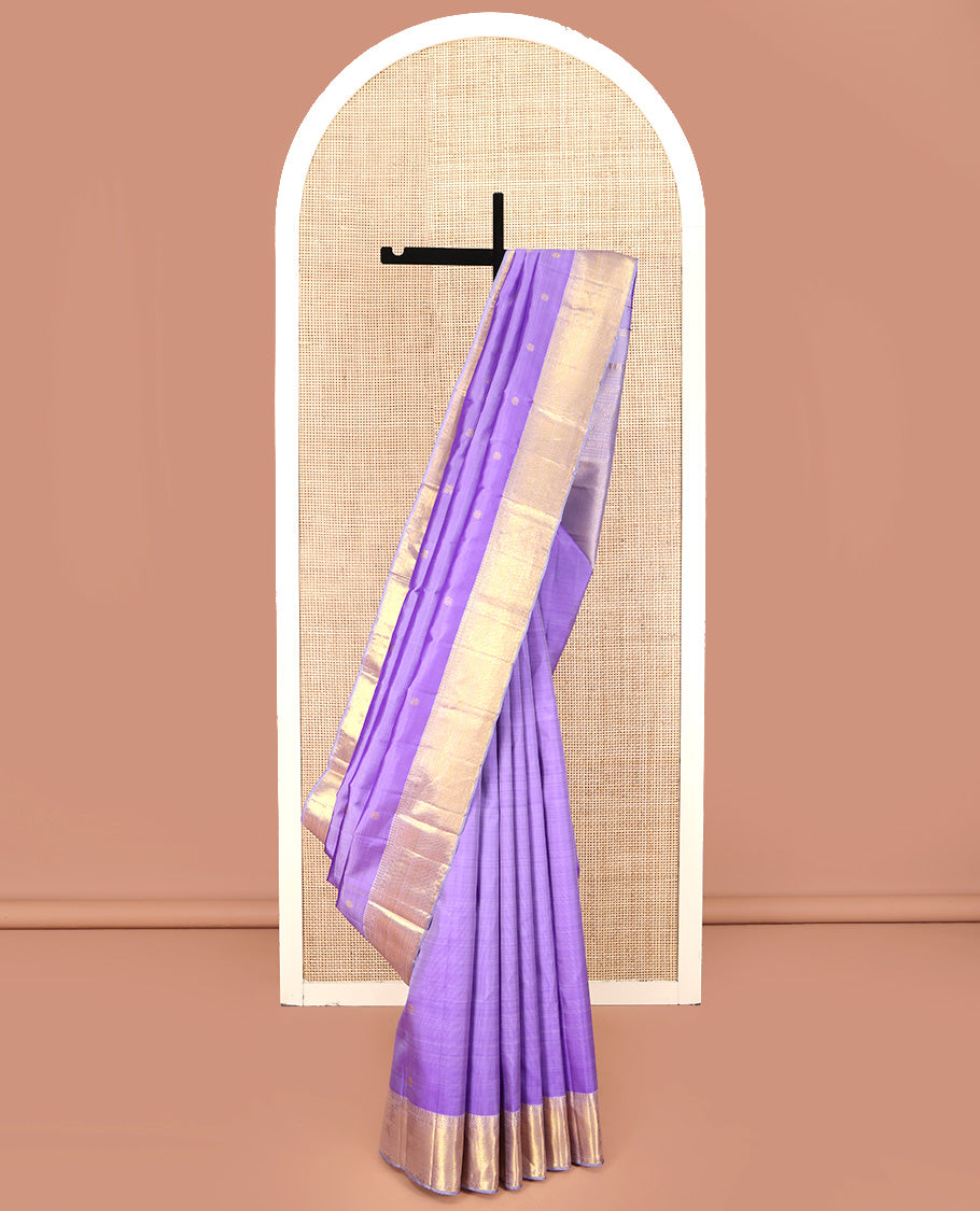 Lavender Kanchipuram Silk Saree, Ornamented with Zari Buttas All Over Its Body, Highlighted by Zari Border of Thilakam Mokku, Poun, and Kathir Designs, Gleaming Pallu, and Paired with a Matching Blouse