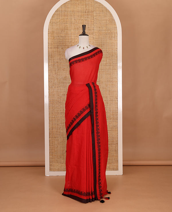 Red plain khadi cotton saree with contrast border and plain pallu with tussels