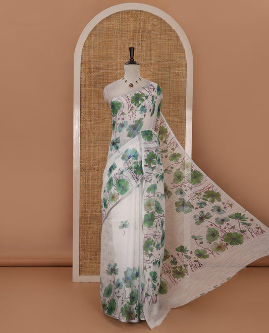White-base poppy-style green-color floral motifs printed linen saree, piping zari border, pallu steeped with floral print & floral matching blouse